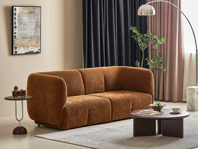 Brown sofa in a modern living room with decor elements.