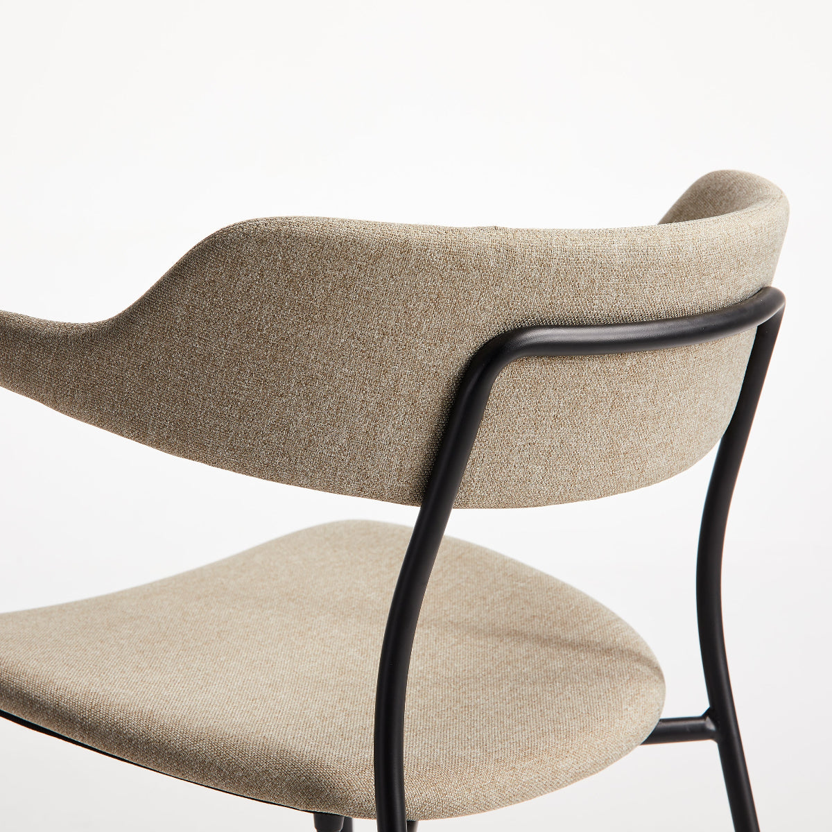Beige chair with black metal frame on a white background