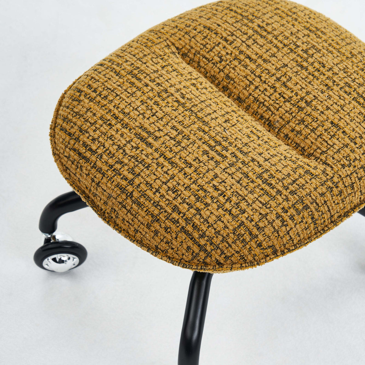 Round woven ottoman with wheels on a white background