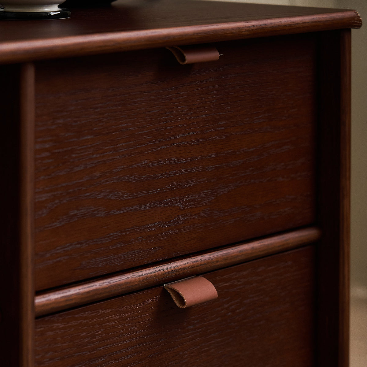 Close-up of a wooden drawer unit with two drawers.