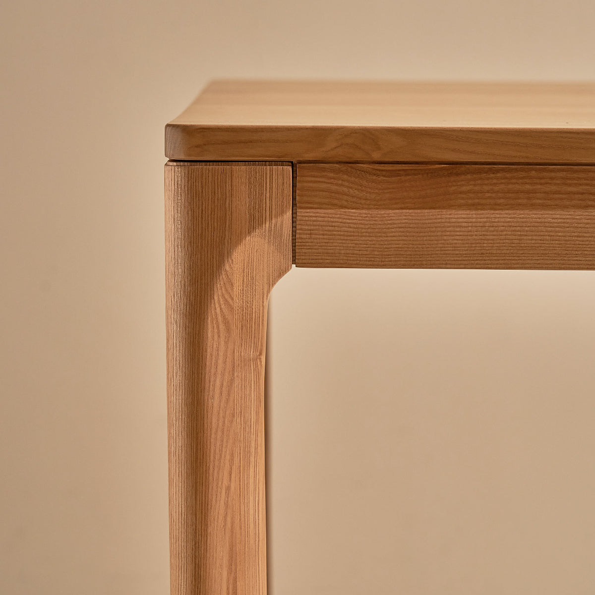 Wooden table close up on a beige background
