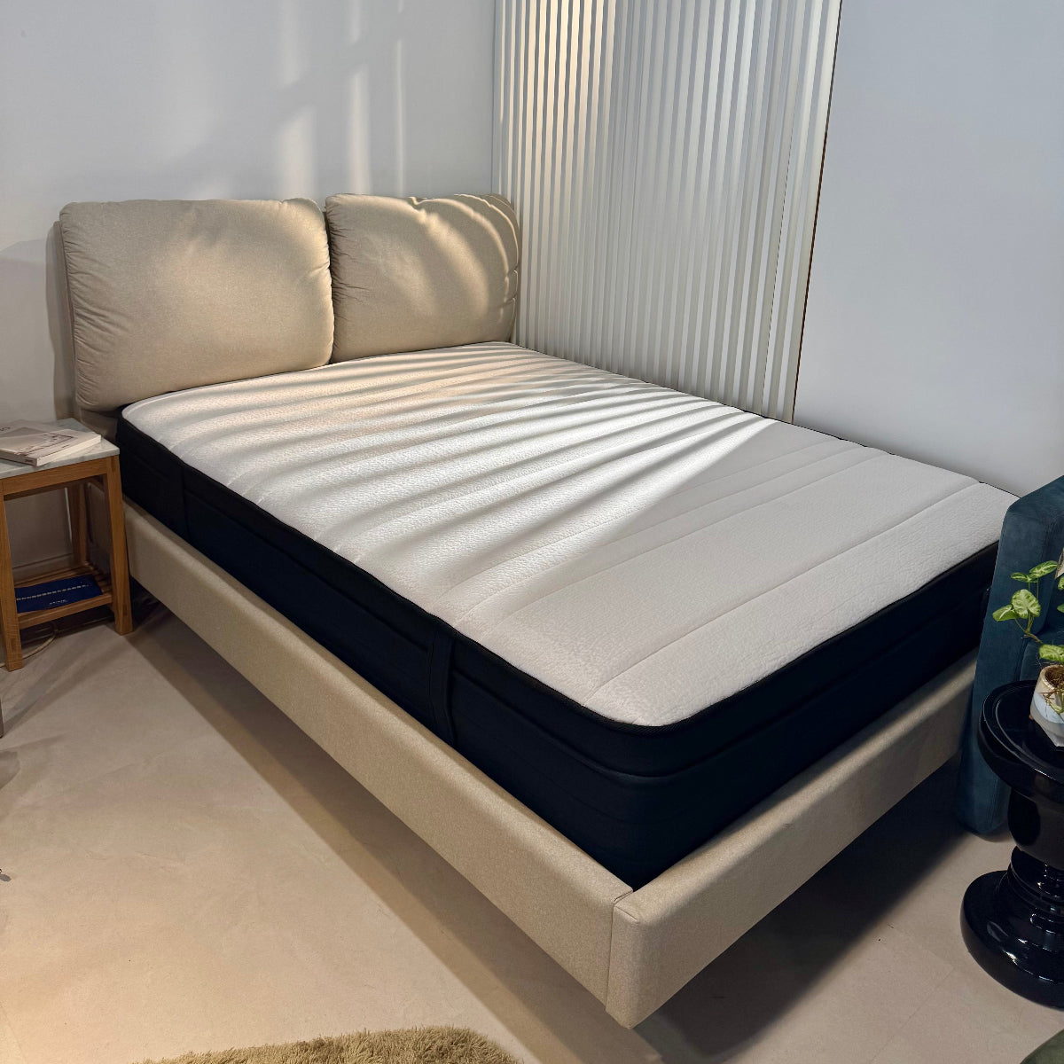 Bed with a mattress in a minimalistic room