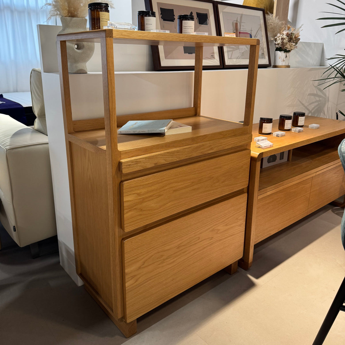 Wooden console table with decorative items in a room setting