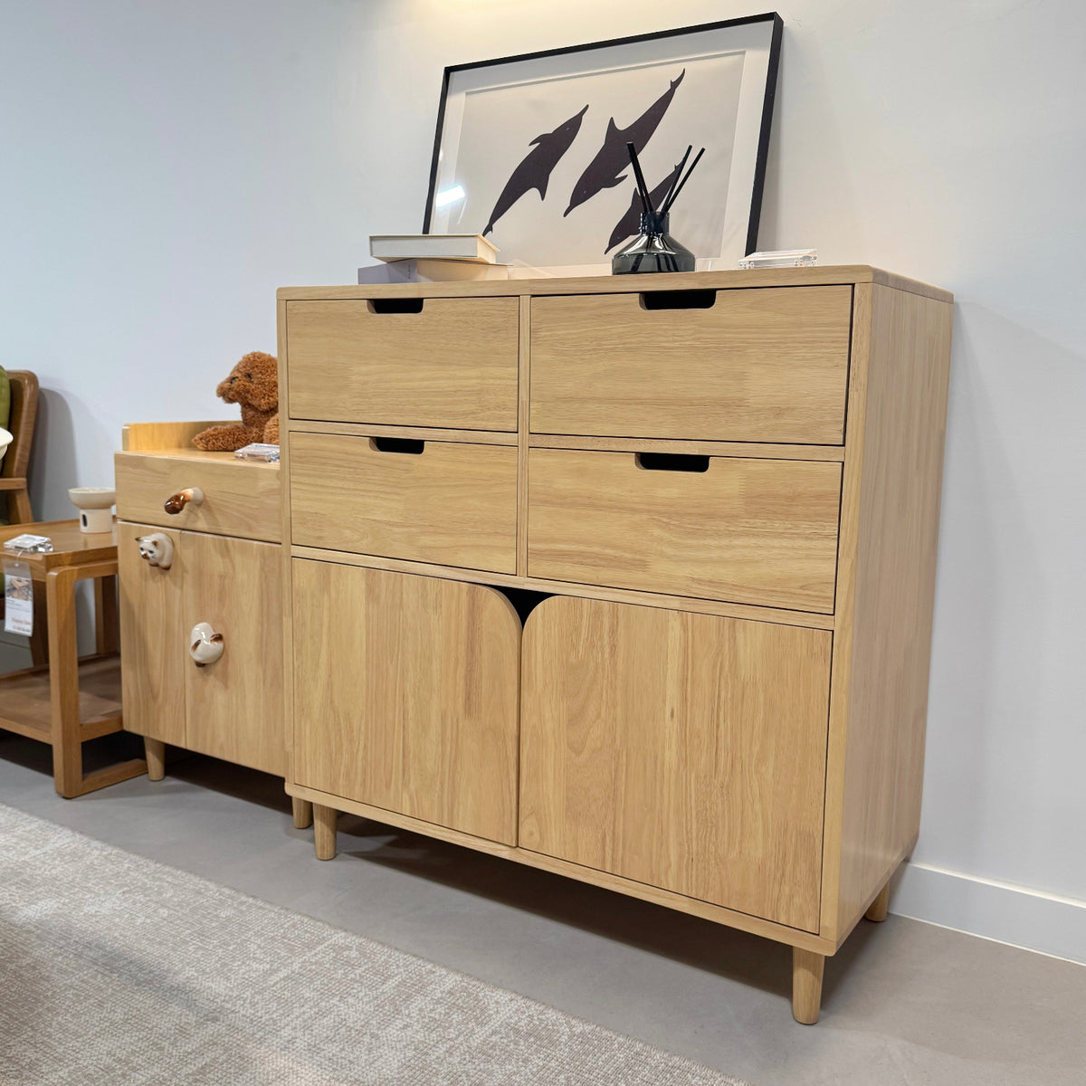 Wooden dresser with multiple drawers in a room setting.