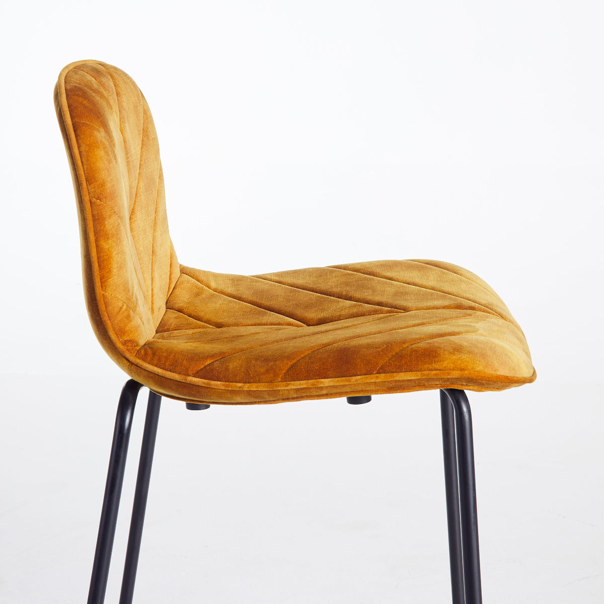 Yellow chair with black legs on a white background