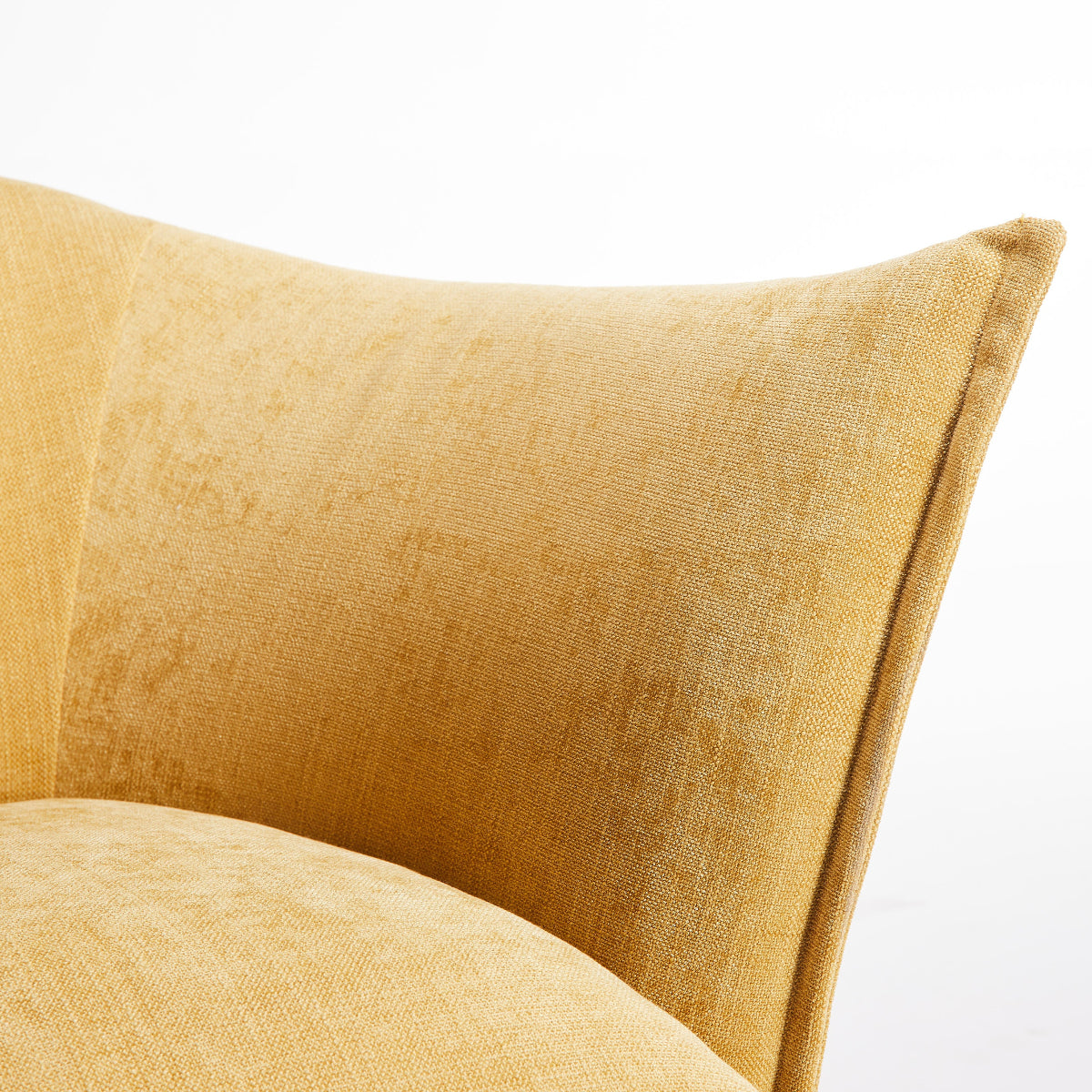 Close-up of a mustard yellow cushion on a white background