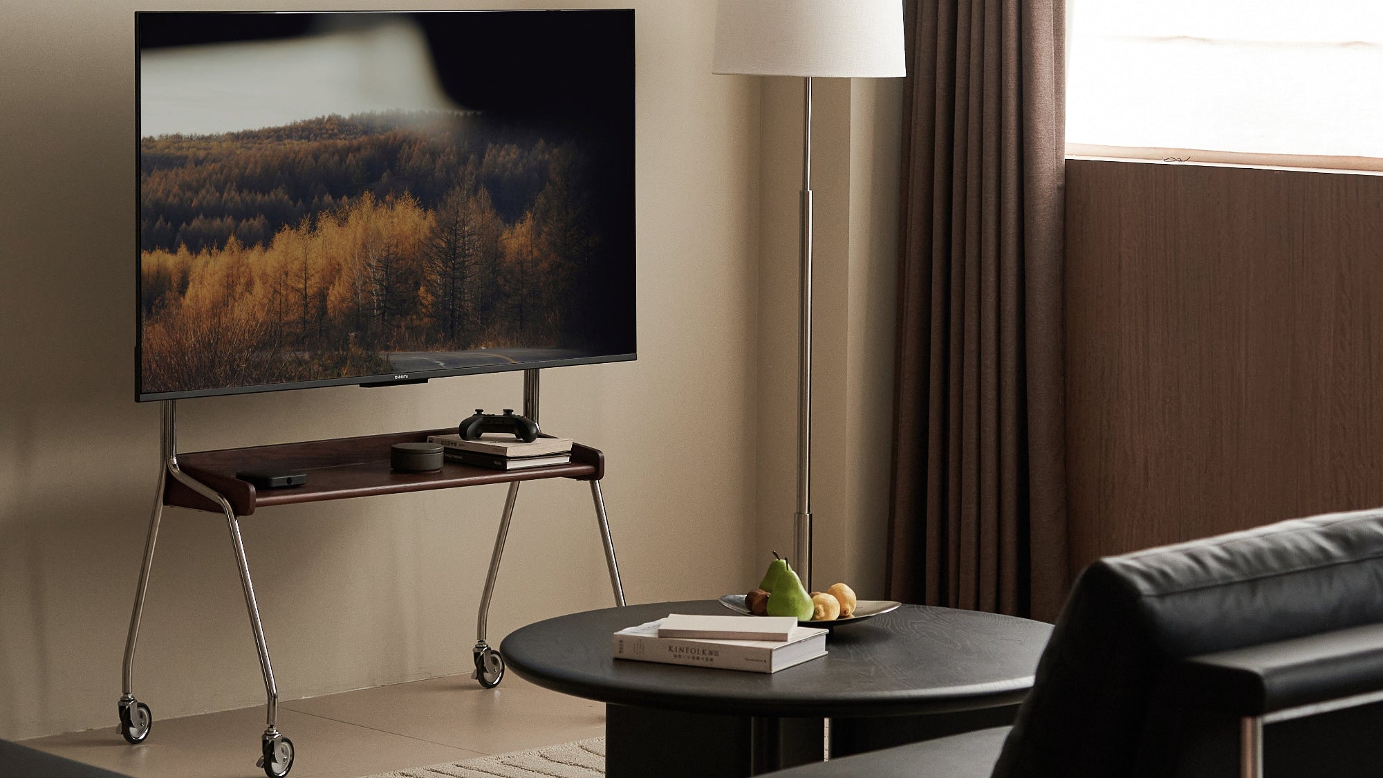 Modern living room with a television, sofa, and coffee table.