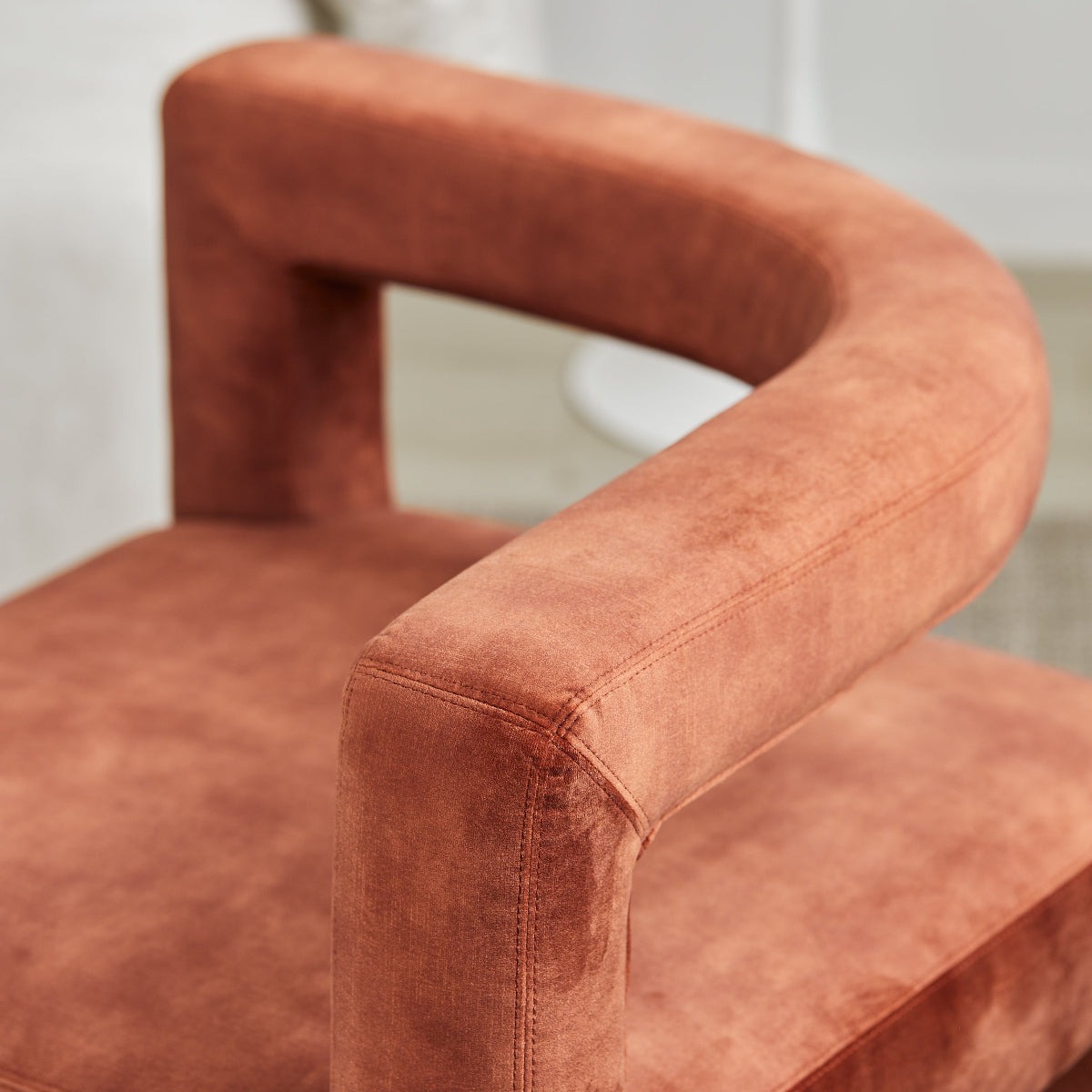 Close-up of a brown chair with a blurred background