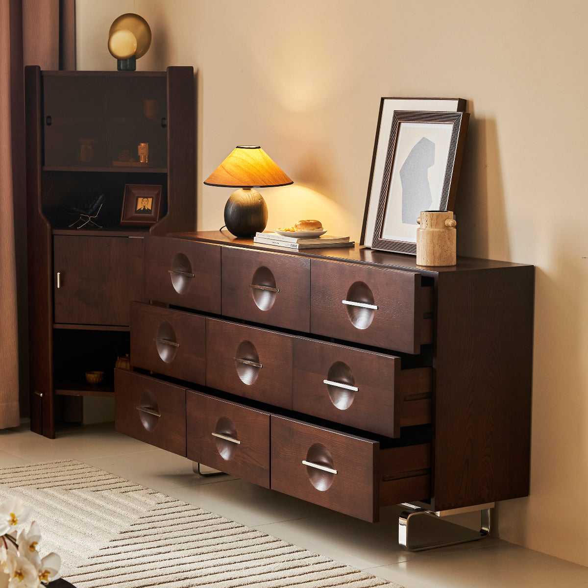 Wooden dresser with decorative items in a room setting