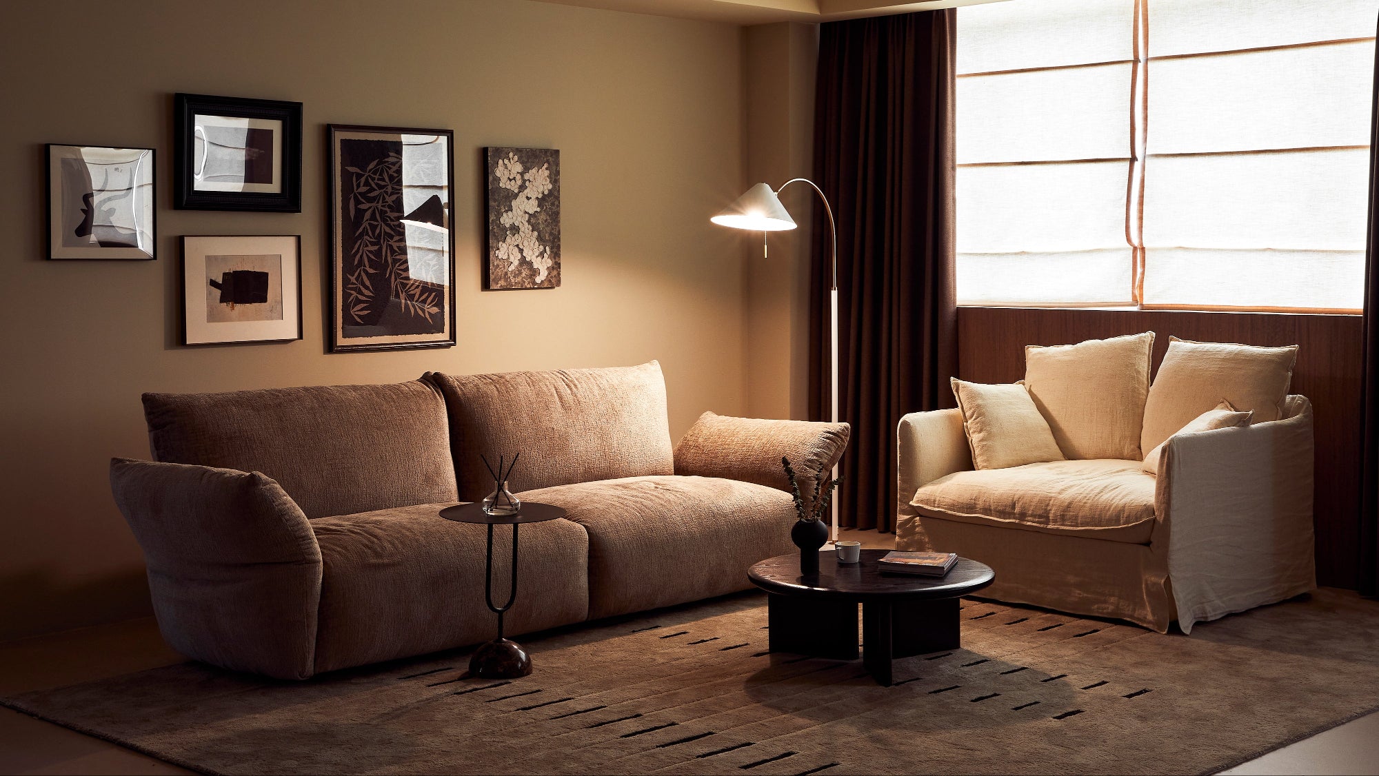 Cozy living room with a beige sofa, armchair, and decorative elements.