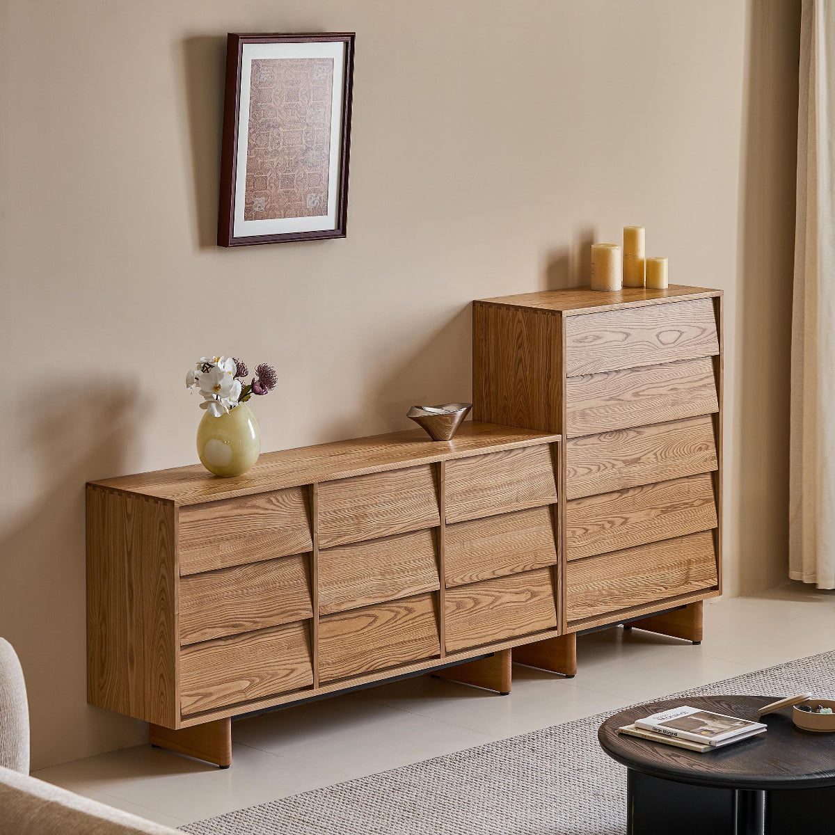Wooden dresser in a living room setting with decor items on top